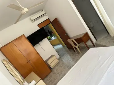an overhead view of a bedroom with a bed and a desk at Hotel Sandiego in Puerto Berrío
