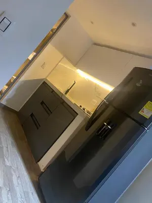 an overhead view of a kitchen with a refrigerator at The oasis apartamento de 3 alcobas Laurles estadio LA70 in Medellín