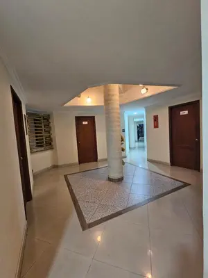 a living room with a pillar in the middle of a room at HOTEL MONTERREY in Ruiosucio