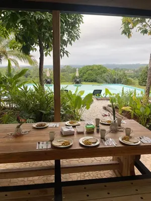a table with plates of food on top of it at Finca Hotel el Valhalla in Doradal