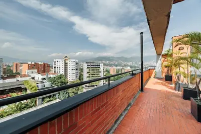 a balcony with a view of a city at Orange Suites by Vibra Bonita in Medellín