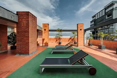 a row of ping pong tables on a building at Orange Suites by Vibra Bonita in Medellín