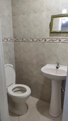a bathroom with a toilet and a sink at Habitación con baño privado#5 in Medellín