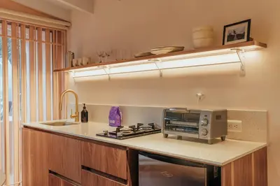 a kitchen with a counter with a microwave and a sink at NEW Cozy Duplex in Laureles with A/C and WI-FI in Medellín