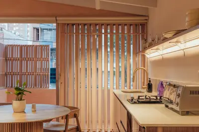 a kitchen with a large window with blinds at NEW Cozy Duplex in Laureles with A/C and WI-FI in Medellín