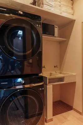 a kitchen with a washing machine and a sink at NEW Cozy Duplex in Laureles with A/C and WI-FI in Medellín