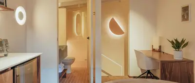 a bathroom with a toilet and a desk in a room at NEW Cozy Duplex in Laureles with A/C and WI-FI in Medellín