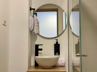 a bathroom with a sink and a mirror at Oliving by Wynwood House in Medellín