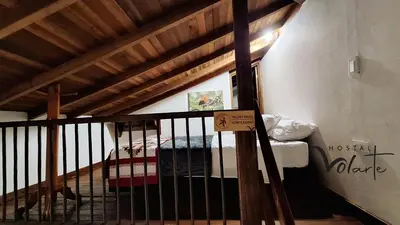 a bunk bed in a room with a wooden ceiling at Volarte Hotel in Jardin