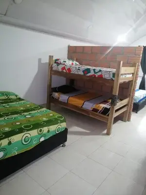 two bunk beds sitting in a room with at Casa low cost in La Dorada