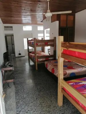 a room with four bunk beds and a ceiling at Casa low cost in La Dorada