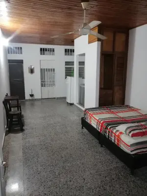 a bedroom with a bed and a ceiling at Casa de relajación low cost in La Dorada