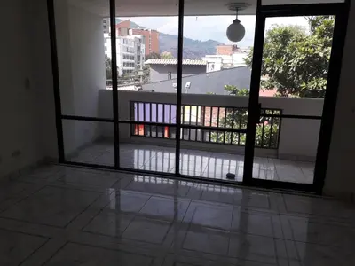 an open door to a balcony with a view at cool de laureles Medellín in Medellín
