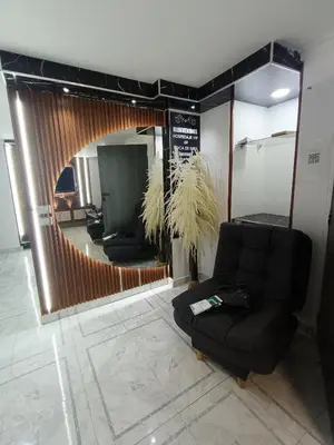 a living room with a couch and a mirror at cool de laureles Medellín in Medellín
