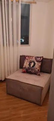 a bed with a pillow on top of it in a room at Casalba in Bello