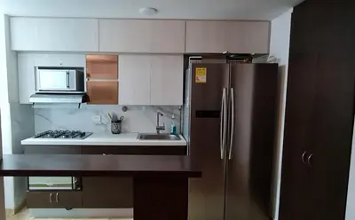 a kitchen with a stainless steel refrigerator and a sink at Casalba in Bello