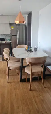 a dining room with a table and chairs in a kitchen at Casalba in Bello