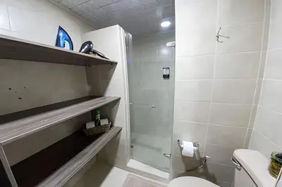 a bathroom with a shower stall and a toilet at Vistas Top | Parking | Cerca De Estadio y 