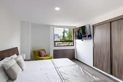 a bedroom with a large bed and a window at Vistas Top | Parking | Cerca De Estadio y 