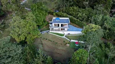 an overhead view of a house in the forest at Poblado Mansion With Hot Tub & A/C Sleeps 9 in Medellín