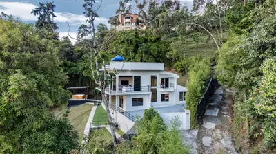 an aerial view of a house in the forest at Poblado Mansion With Hot Tub & A/C Sleeps 9 in Medellín