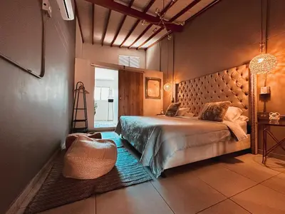 a bedroom with a bed and a bag on the floor at PROVENZA LUXURY APARTMENTS TERRAZA in Medellín