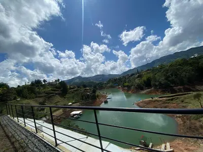 a view of a river from a bridge at Springfield Ecoloft- Guatapé in Guatapé