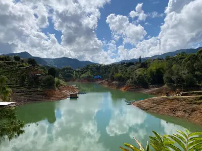 a view of a river with mountains in the background at Springfield Ecoloft- Guatapé in Guatapé