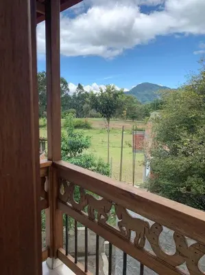 a balcony with a view of a field and trees at Apartamento Campestre 201 in Jardin