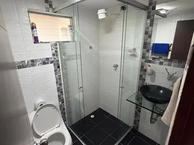 a bathroom with a shower and a toilet and a sink at Amazing one bedroom apartment near the Airport ! in Rionegro