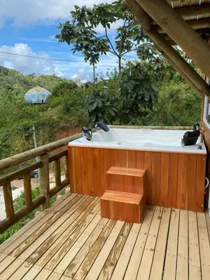 a bath tub sitting on a wooden deck at El mirador de San Joaquin in San Luis