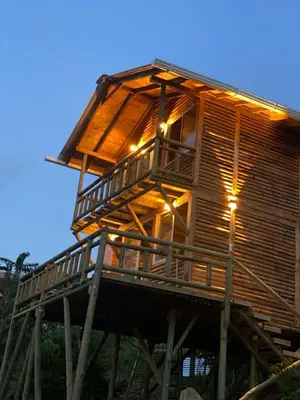 a tree house with lights on top of it at El mirador de San Joaquin in San Luis