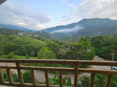 a view of a valley from a wooden railing at El mirador de San Joaquin in San Luis