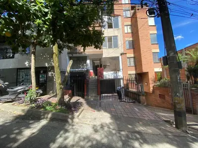 a building on the side of a street at hostal casa prado in in Medellín