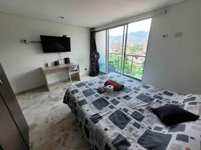 a bedroom with a bed with a stuffed animal on it at Apartamento acogedor barrio la Floresta Medellín in Medellín