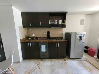 a kitchen with a stainless steel refrigerator in a room at Apartamento acogedor barrio la Floresta Medellín in Medellín