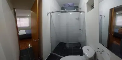 a bathroom with a shower with a toilet and a sink at Casa Palermo Manizales in Manizales