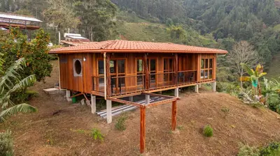 a wooden house on top of a hill at Finca La Arabia Jardín in Jardin