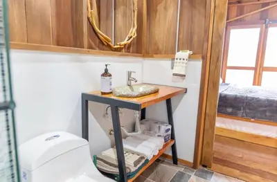 a bathroom with a sink and a toilet at Finca La Arabia Jardín in Jardin
