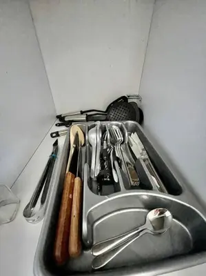a kitchen sink with utensils in it at Milano Manizales in Manizales