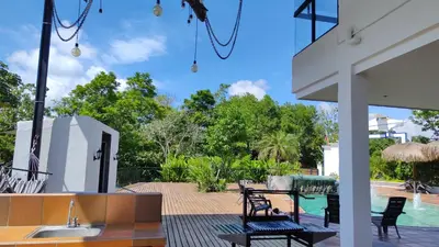 a patio with a sink and a swimming pool at Finca La Casa de Pablo in Doradal