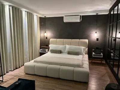 a bedroom with a large white bed with two pillows at LUXURY PALACE POBLADO MANILA in El Poblado