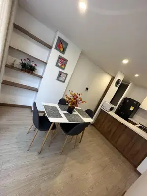 a dining room with a table and chairs in a room at Loft moderno en zona exclusiva in Manizales
