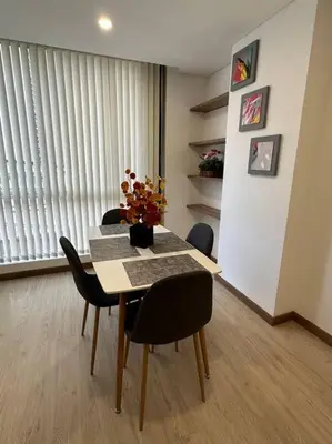 a dining room with a table and some chairs at Loft moderno en zona exclusiva in Manizales