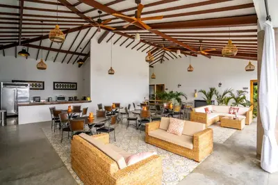 a living room with couches and tables and chairs at Quinta San Felipe in Manizales