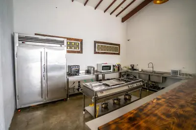 a kitchen with a stainless steel stove and refrigerator at Quinta San Felipe in Manizales
