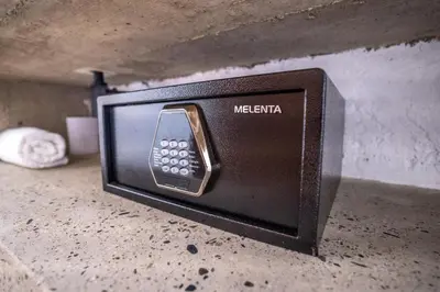 a small microwave sitting on a counter with at Quinta San Felipe in Manizales