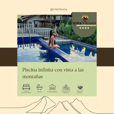 a woman sitting on the edge of a swimming pool at Villa Tikuna in Mariquita