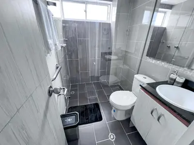 a bathroom with a shower and a toilet and a sink at Medellin's Coolest neighborhood in Medellín