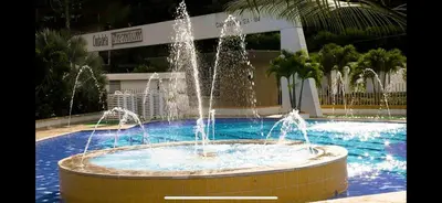 a fountain in the middle of a swimming pool at Casa 4E Ciudadela Premium in San Jerónimo